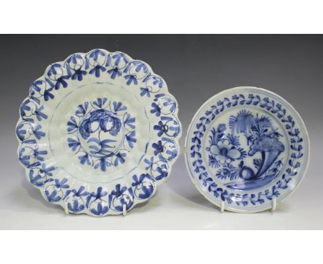 An English Delft lobed dish, mid-18th century, blue painted with a central flower within a border of stylized foliage, diamet