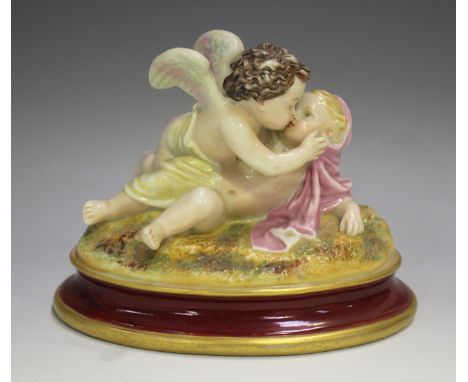 A Royal Worcester figure group, circa 1867, modelled as a cherub kissing a putto, raised on an oval base, printed marks to ba