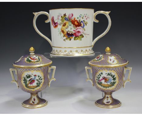 A large English porcelain two-handled loving cup, probably Coalport, circa 1830, painted with opposing floral bouquets above 