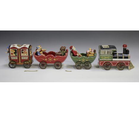 A Villeroy &amp; Boch porcelain night light train and cover with two Villeroy &amp; Boch night light carriages and a sleigh, 