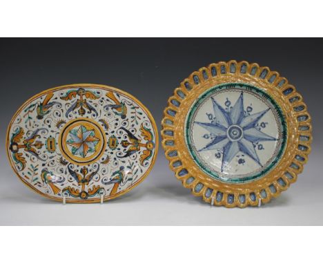 An unusual maiolica dish with gadrooned rim, late 17th century, painted in blue to the centre with a compass rose within the 