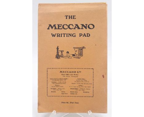 An original Meccano writing pad comprising of orange cover with pink paper with blue borders and Meccano decoration to top, u