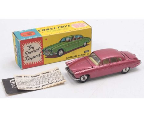 A Corgi Toys No. 238 Jaguar Mk10 comprising cerise body with lemon interior, luggage load and spun hubs, housed in the origin