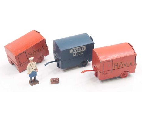 Charbens group of 3 to include a Dairy milk hand cart, in blue, with the figure, and two Hovis hand-operated carts, one missi