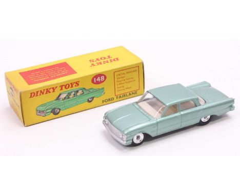 Dinky Toys No. 148 Ford Fairlane in an off-green metallic body with a white interior and silver spun hubs, housed in a pictor