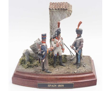 A 54mm scale handpainted military figure diorama titled Spain 1809, depicting 3 standing military figures, one carrying gun, 
