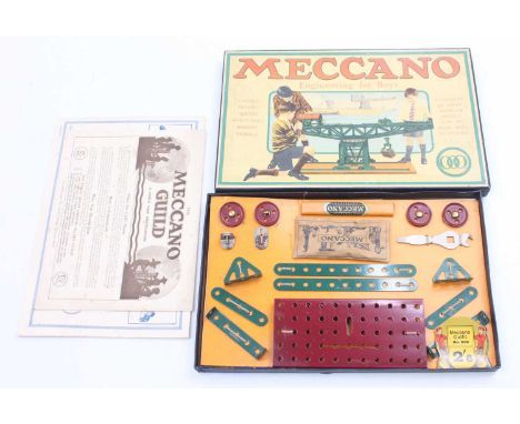 Meccano 1930s Outfit 000, dark red and dark green example, housed on the original backing card, with instructions, original p