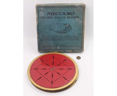 Meccano part No.167 gear roller bearing. This is a version in red and gold, housed in the original blue labelled card box