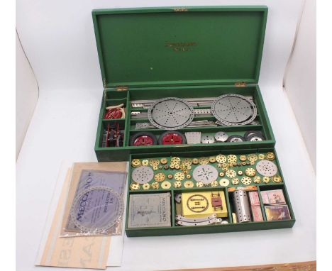 A Meccano No. 6A outfit in green cabinet, circa 1929, includes the special order nickel parts, including electric motor, cloc