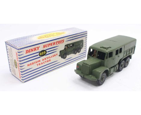 Dinky Toys No. 689 Medium Artillery Tractor, military green body with green tin rear canopy, seated drive figure with green h