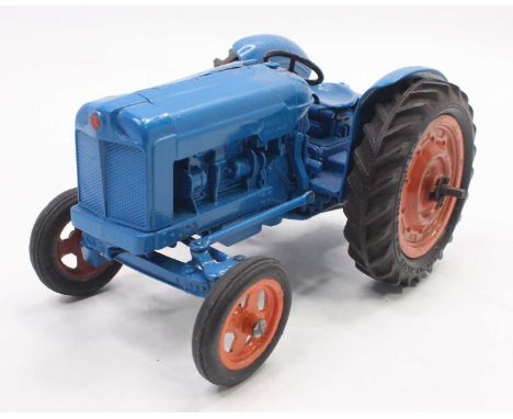 Chad Valley diecast and clockwork model of Fordson Major tractor comprising of blue body with orange hubs and clockwork mecha