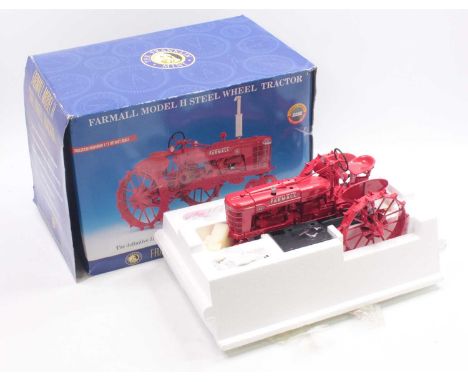 Franklin Mint 1/12 scale diecast model of a Farmall Model H farm tractor, finished in red and housed in the original packagin