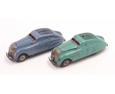 Two Schuco Kommando tinplate clockwork cars, to include one in blue and one in teal. Both are in very good condition and are 