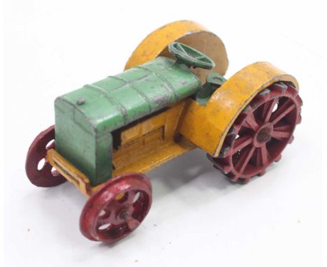 A Dinky Toys No.22E pre-war farm tractor, comprising of yellow and green body with red hubs (playworn with little fatigue), M