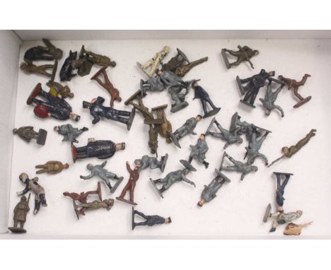 A small quantity of pre-war Crescent, Skybirds, and other lead soldiers, including three station staff, a large quantity of g