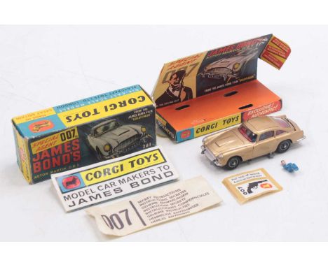Corgi Toys No. 261 James Bond's Aston Martin DB5, metallic gold body, with wire wheels, all mechanisms in working order, come