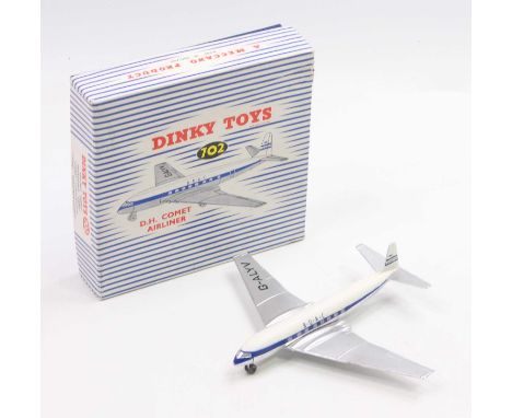 Dinky Toys No. 702 D.H Comet Airliner in a silver bottom, dark blue middle and white top fuselage, with silver wings and lett