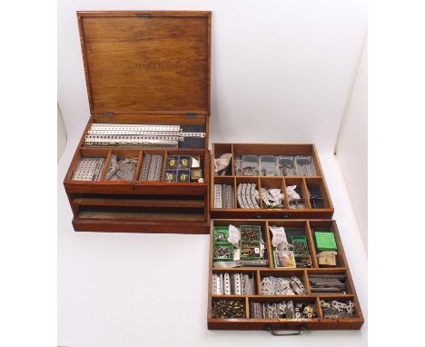 A Meccano No. 6 Nickel set, housed in the original oak Meccano larger two-drawer display cabinet containing a large quantity 