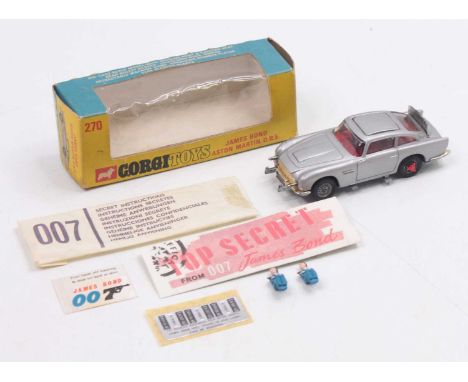 Corgi Toys No. 270 James Bond Aston Martin DB5 comprising of silver body with red interior, with Bond driver figure and Bandi