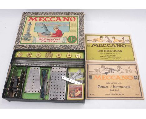 A Meccano circa 1920s 1X outfit gift set, housed in the original mottled card box, comprising various nickel and brass compon