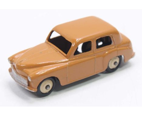 Dinky Toys No. 154 Hillman Minx in butterscotch cream body with cream rigid hubs, loose exampleSome chips to the bonnet and r