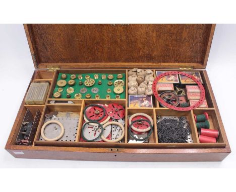 A Meccano circa 1925 6A gift set, housed in the original oak wooden box, comprising of various mainly nickel components to in