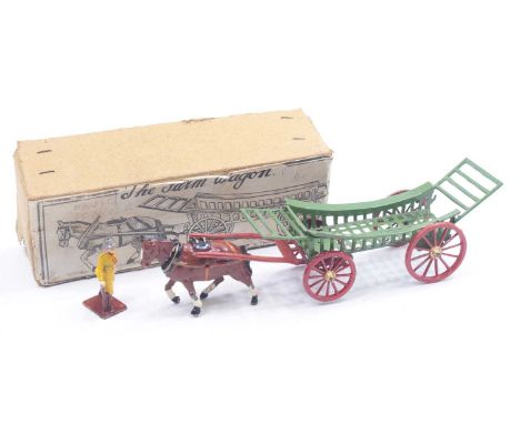 A Charbens farm wagon comprising green and red farm wagon with green rakes, brown horse and farming figure, housed in the ori