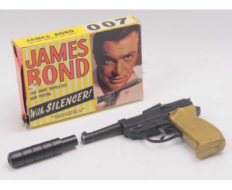 Lone Star "James Bond" Cap Pistol - finished in black with gold butt, also comes complete with silencer, in the original "Oli