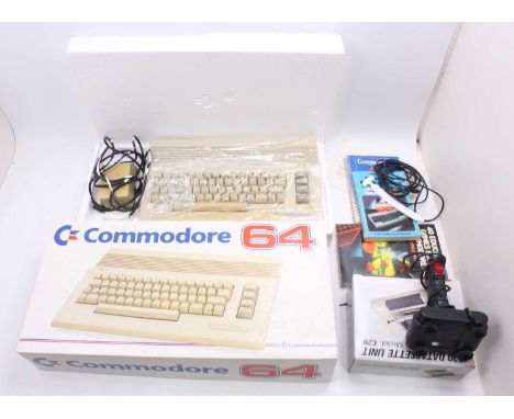 A Commodore 64C Sports Pack, comprising of Commodore 64C computer, 1530 data recorder, and Quick Shot Joystick, together with