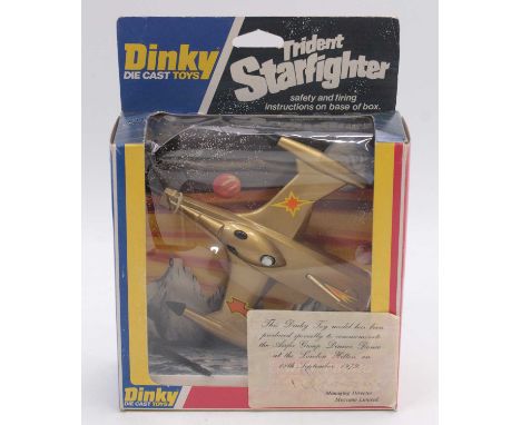 Dinky Toys No.362 rare issue of a Trident Star Fighter finished in gold with yellow and orange labels, black missiles, with l