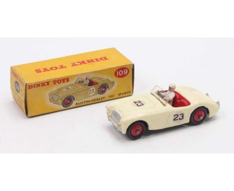 Dinky Toys No. 109 Austin Healey Sports 100 comprising cream body with red interior and red hubs with driver and racing No. 2
