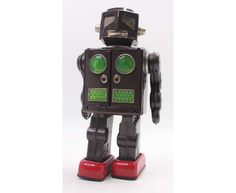 1960s Japanese Attacking Martian tinplate robot, by SH Horikawa, grey/brown body, with opening chest doors to reveal 2 guns, 