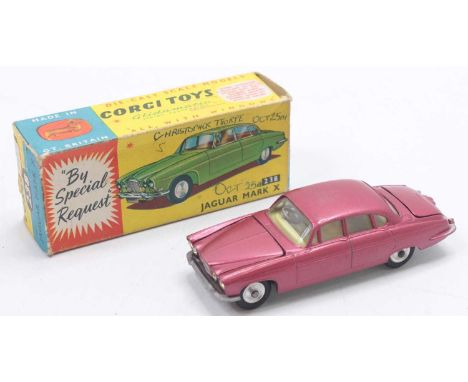 Corgi Toys No. 238 Jaguar Mk 10 comprising metallic cerise body with lemon interior, spun hubs with two pieces of luggage in 