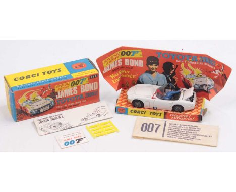 Corgi Toys No. 336 James Bond's Toyota 2000 GT comprising of white body with black interior, and two figures, fitted with wir
