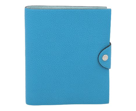HERMÈS Notizbuch "ULYSSE PM". Koll. 2004. Hellblaues Togoleder mit silberfarbener Hardware. Einlage und Box anbei. Sehr guter