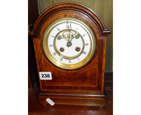 Edwardian mahogany dome topped mantle clock with inlaid decoration and visible escapement