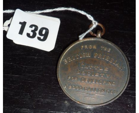 Farming Interest:- Large bronze medallion from the British Friesian Cattle Society for developing a 2000 gallon cow! 1931