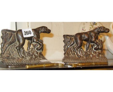Two 19th c. cast iron shooting dogs bookends and two old brass glass cutting tools