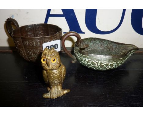 Antique bronze oil lamp, heavily decorated bronze cup (A/F), and a match holder in the shape of an owl (with glass eyes)