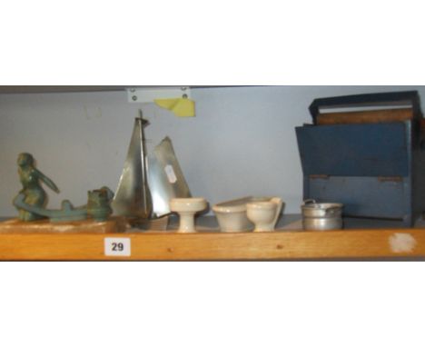 Art Deco painted metal figural lamp of a female nude on soapstone base, a similar yacht model, a child's tinplate mangle and 