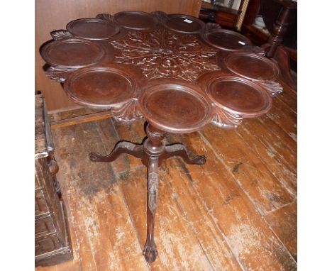 Georgian mahogany supper table with central carved motif, flanked by 9 plate settings, on birdcage base with tripod legs