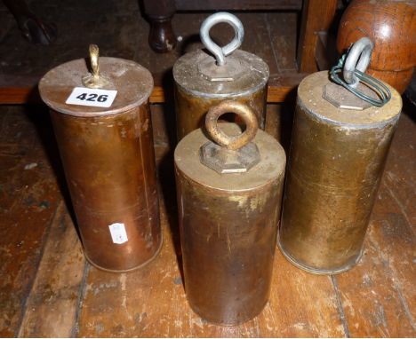 Four heavy brass clock weights
