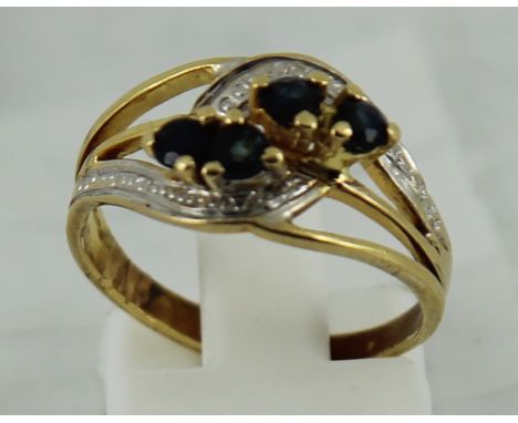 Yellow gold ring with blue stones possibly 14ct size: N  