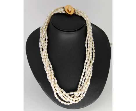 a 3 string seed pearl necklace with 14ct gold clasp 