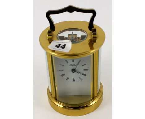 an unusual circular brass and glass cased carriage clock with platform escapement (not working) 