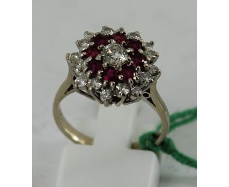 18ct white gold ruby and diamond cluster ring. Size: M 