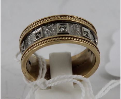 9ct gold wedding band style ring with white gold in centre and 5 Diamonds. Size: S total weight 7.6g  