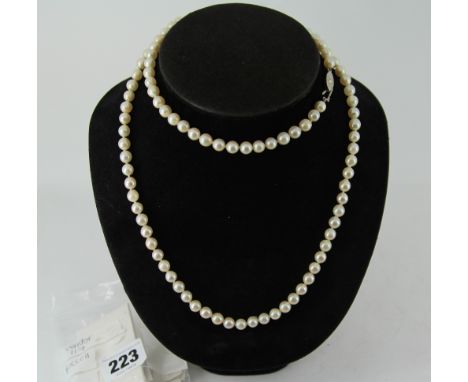 Real pearl necklace with silver coloured clasp approximately 80cm long  