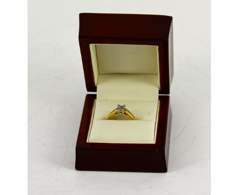 18ct Diamond Ring - four square cut, centre stones - 8 smaller on shoulders  