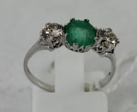 White gold emerald and diamond three stone ring. Size: O 